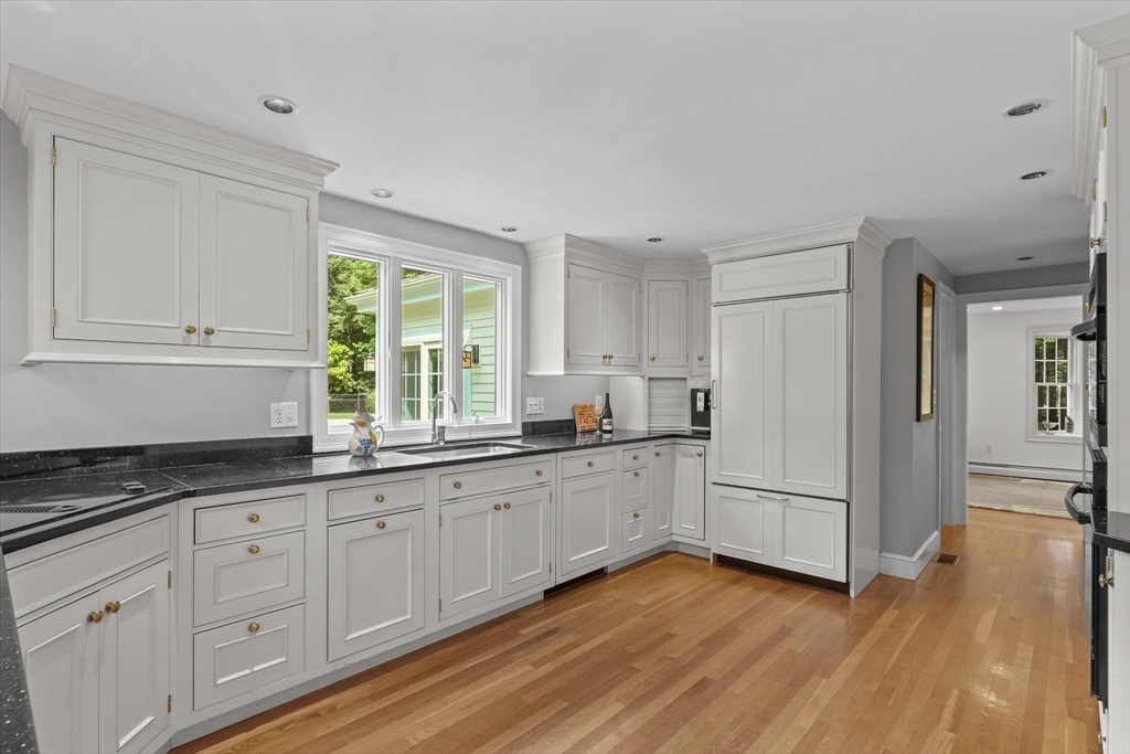 7 Kimball Road Boxford, MA 01921 - Photo 8 of 41 a kitchen with granite countertop white cabinets and white appliances