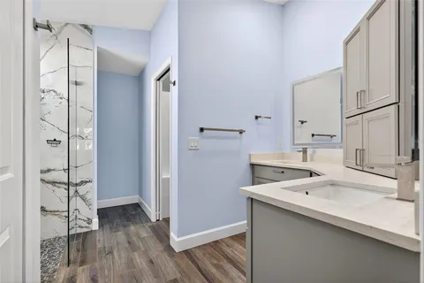 a bathroom with a toilet a sink and a mirror