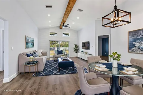 a kitchen with stainless steel appliances kitchen island granite countertop a refrigerator and a sink
