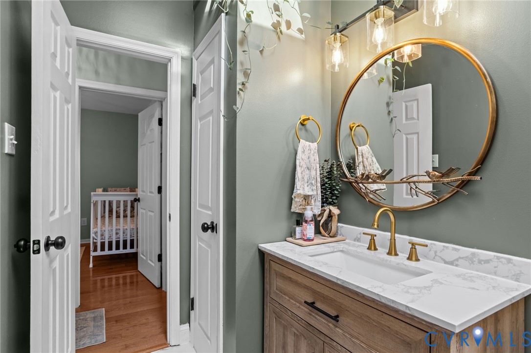 1201 Mt Hermon Road Midlothian, VA 23112 - Photo 19 of 48 Bathroom featuring vanity and light wood-style flo