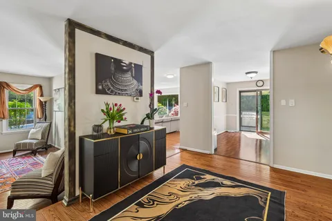 a kitchen with stainless steel appliances granite countertop a refrigerator and a stove