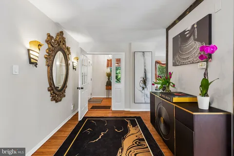 a kitchen with stainless steel appliances granite countertop wooden cabinets stove top oven and sink