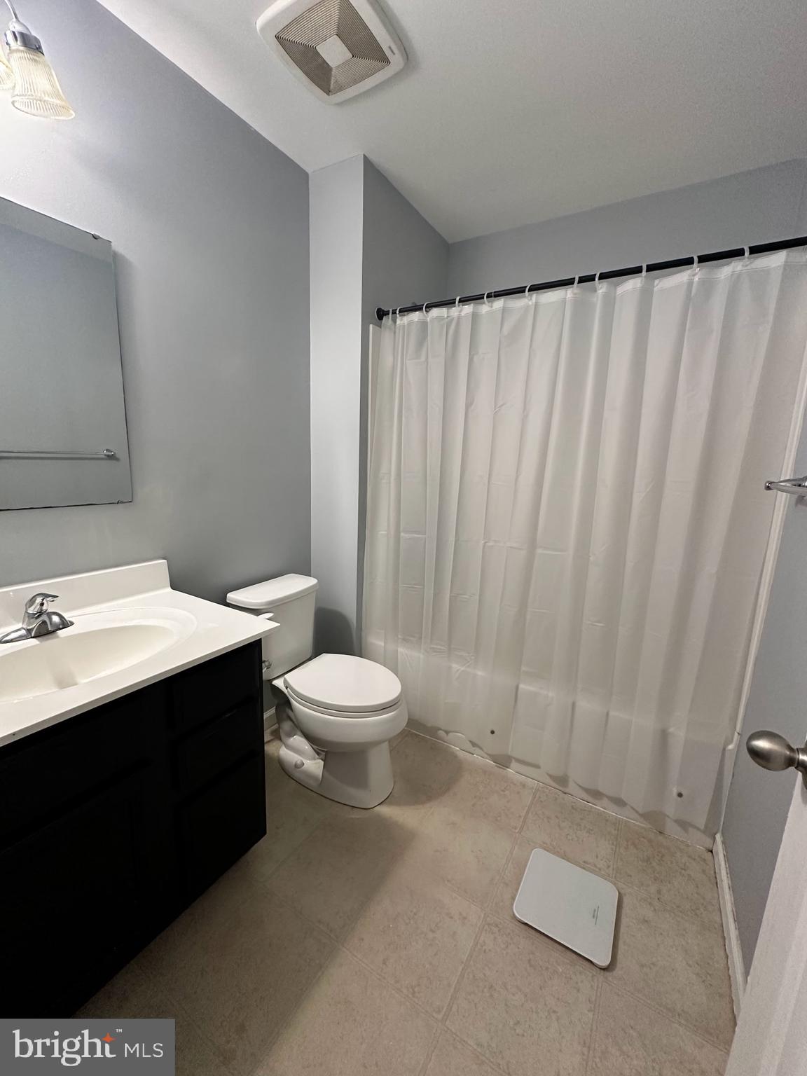330 Nob Hill Road Dover, DE 19901 - Photo 11 of 12 a bathroom with a sink a toilet and shower