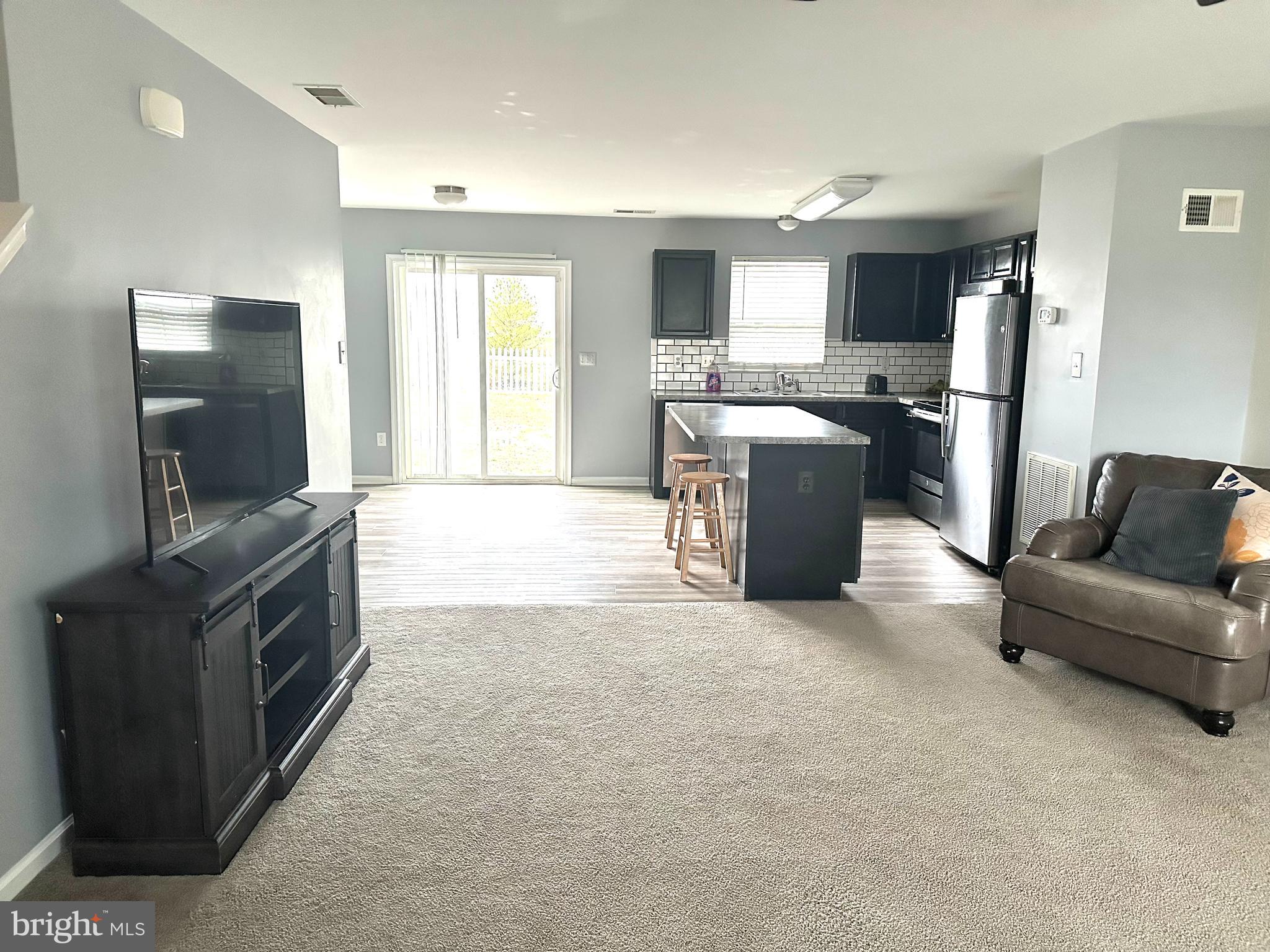 330 Nob Hill Road Dover, DE 19901 - Photo 4 of 12 a living room with furniture and a flat screen tv