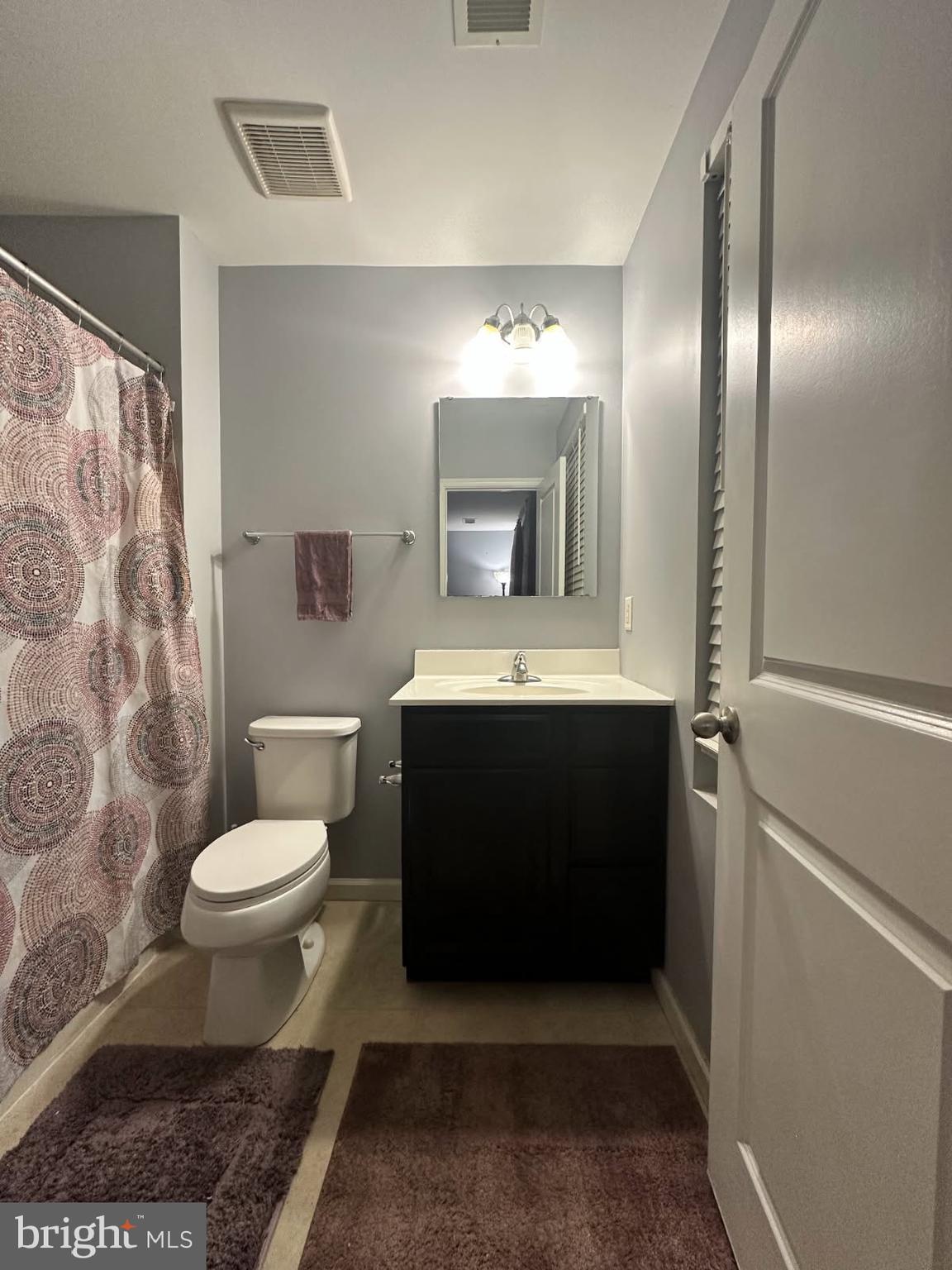 330 Nob Hill Road Dover, DE 19901 - Photo 7 of 12 a bathroom with a sink toilet and shower