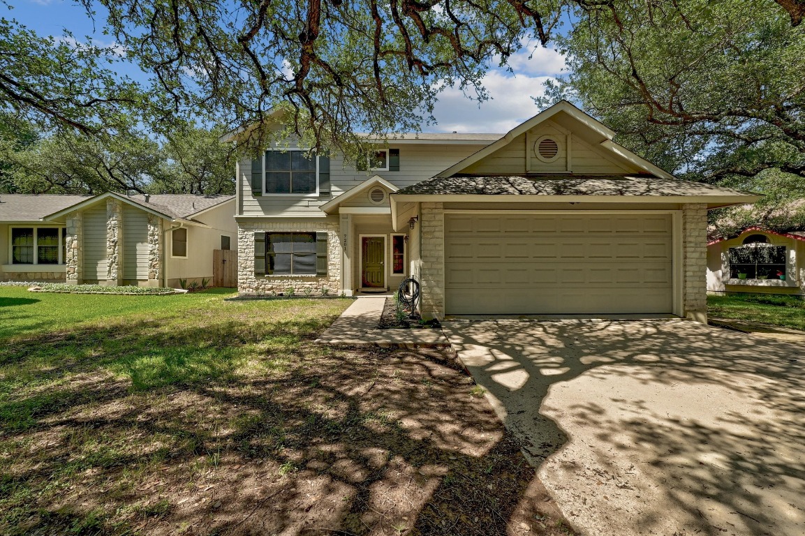 7201 Pine Bluffs Trail Austin, TX 78729 - Photo 1 of 25 a front view of a house with a yard