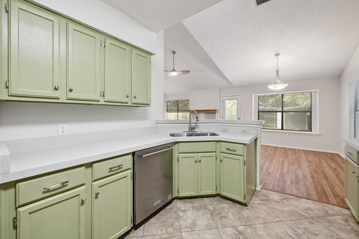 7201 Pine Bluffs Trail Austin, TX 78729 - Photo 11 of 25 a kitchen with sink cabinets and window