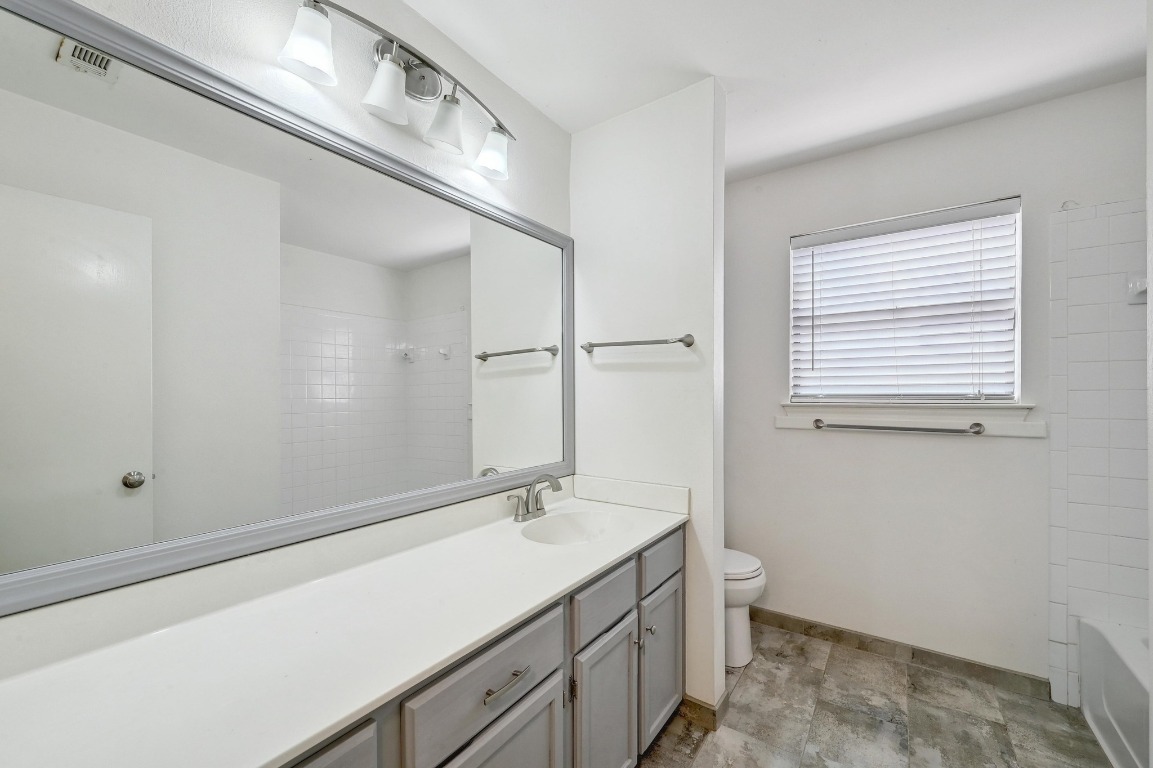7201 Pine Bluffs Trail Austin, TX 78729 - Photo 15 of 25 a bathroom with a sink and a mirror