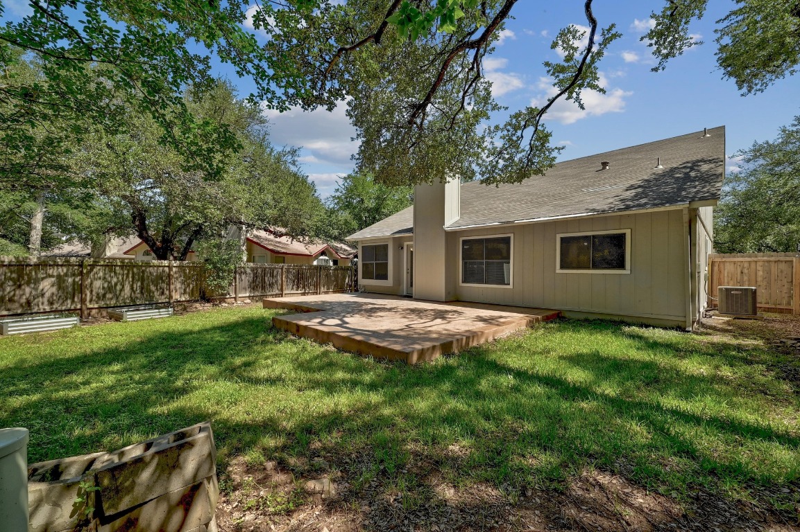 7201 Pine Bluffs Trail Austin, TX 78729 - Photo 24 of 25 a view of a house with backyard and porch