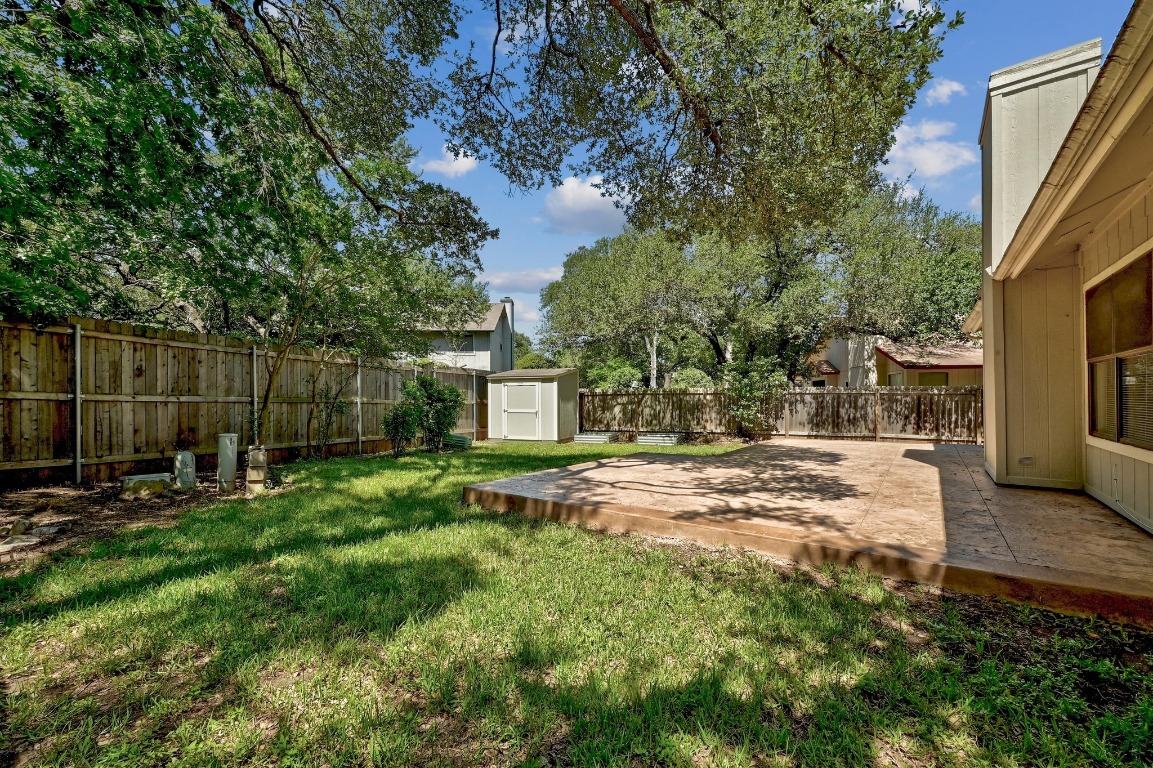 7201 Pine Bluffs Trail Austin, TX 78729 - Photo 25 of 25 a view of a yard with a large tree