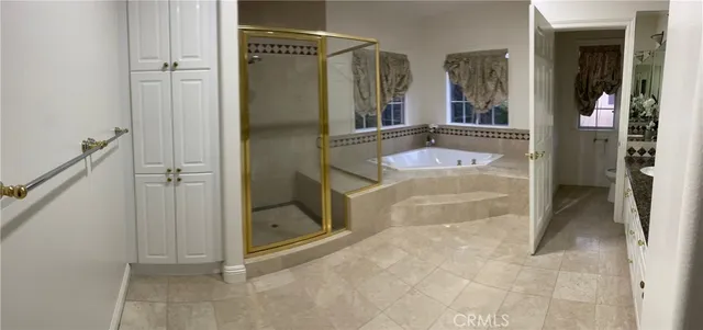 a bathroom with a tub and shower