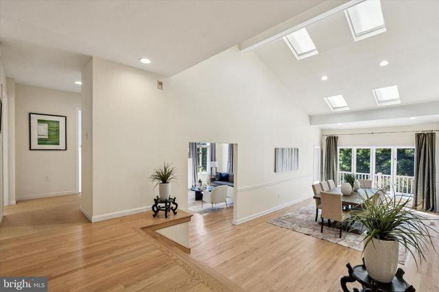 a kitchen with a cabinets and wooden floor