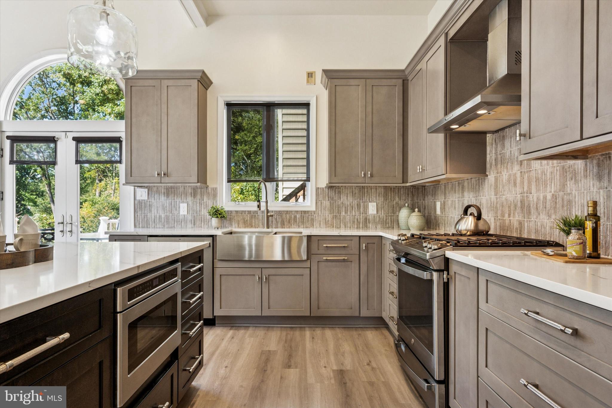 241 Painter Road Media, PA 19063 - Photo 15 of 44 a kitchen with a sink stove and cabinets