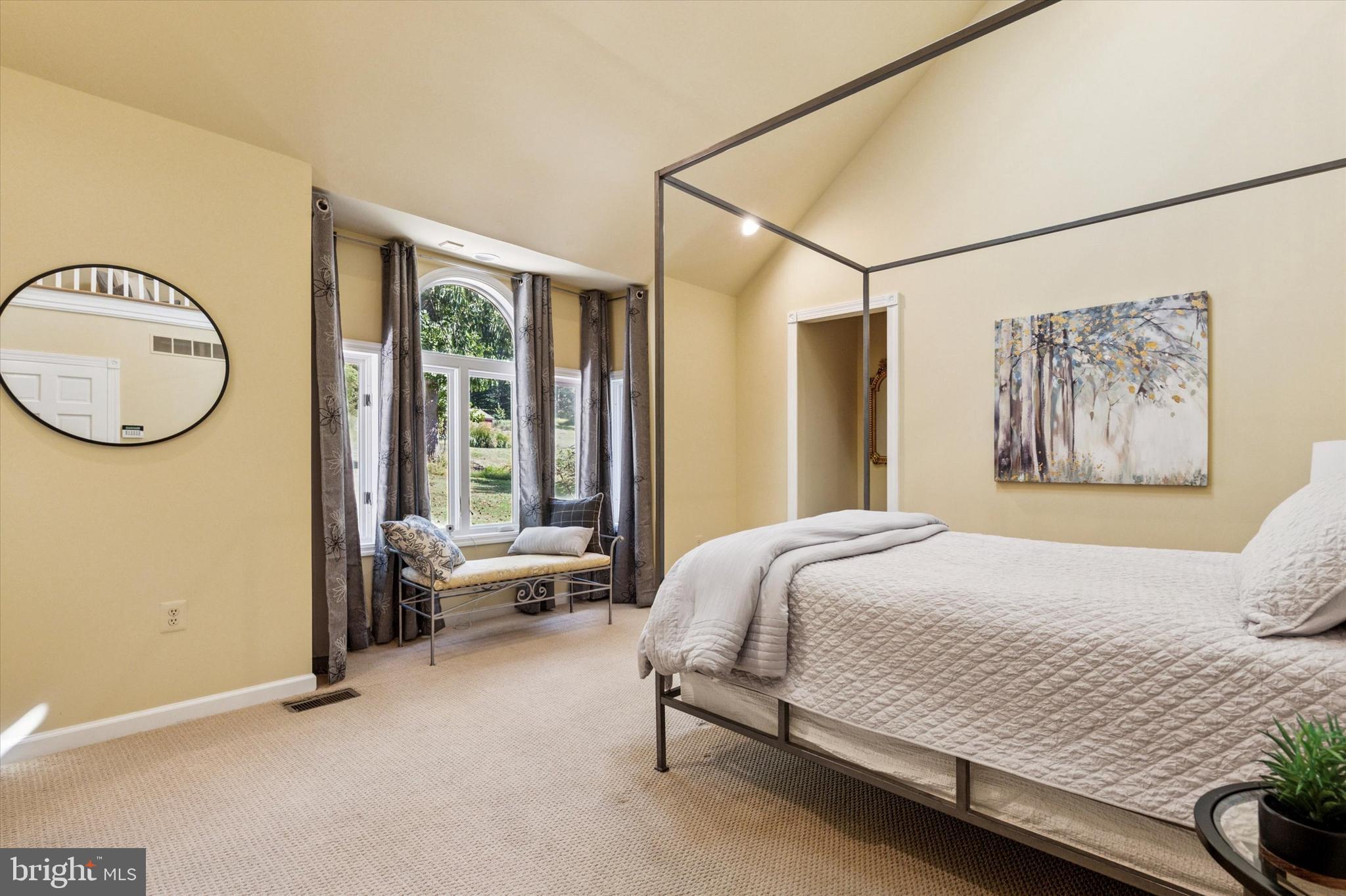 241 Painter Road Media, PA 19063 - Photo 23 of 44 a bedroom with a bed and a chandelier