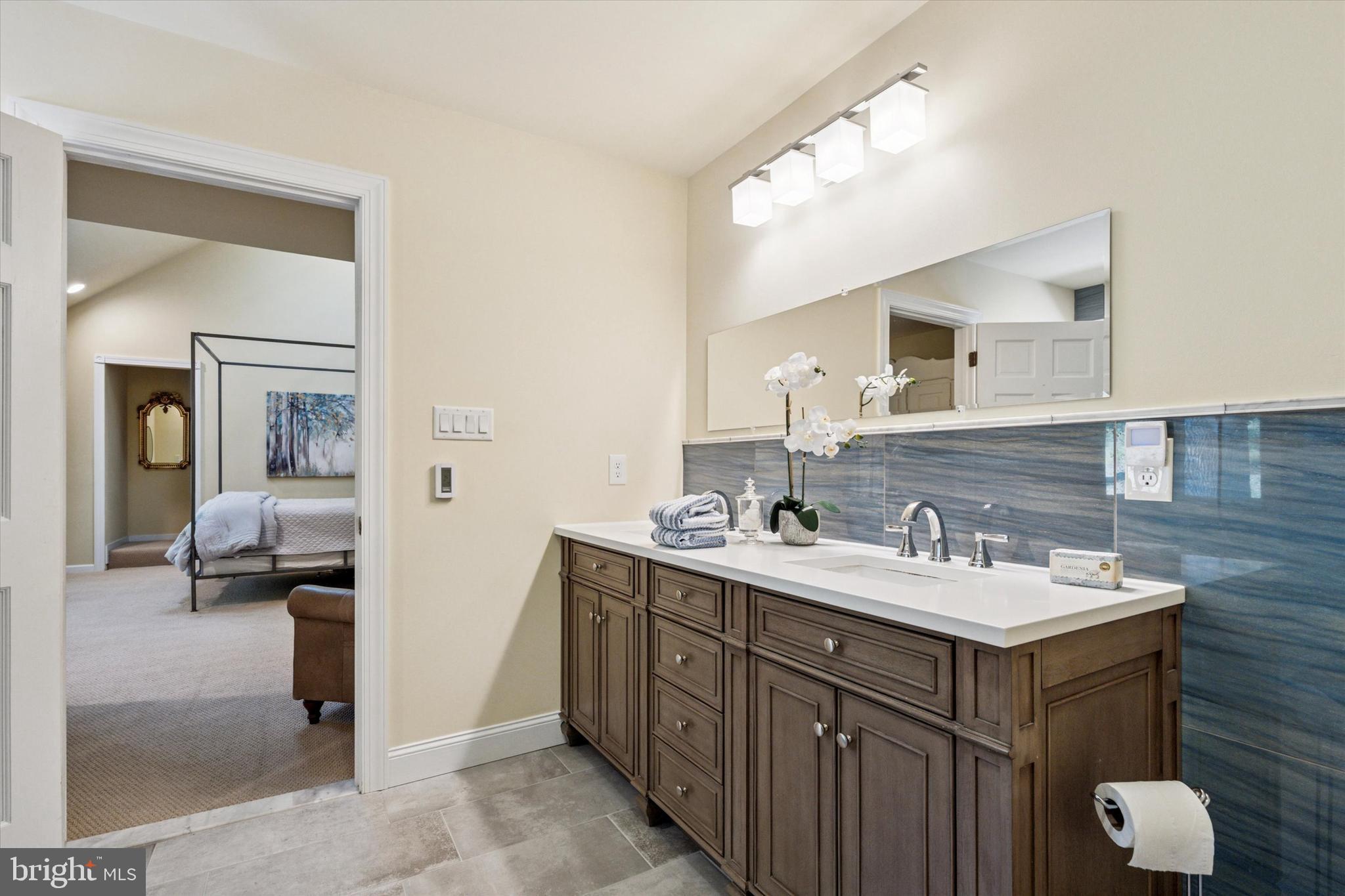 241 Painter Road Media, PA 19063 - Photo 24 of 44 a en suite bathroom with a double vanity sink and a mirror