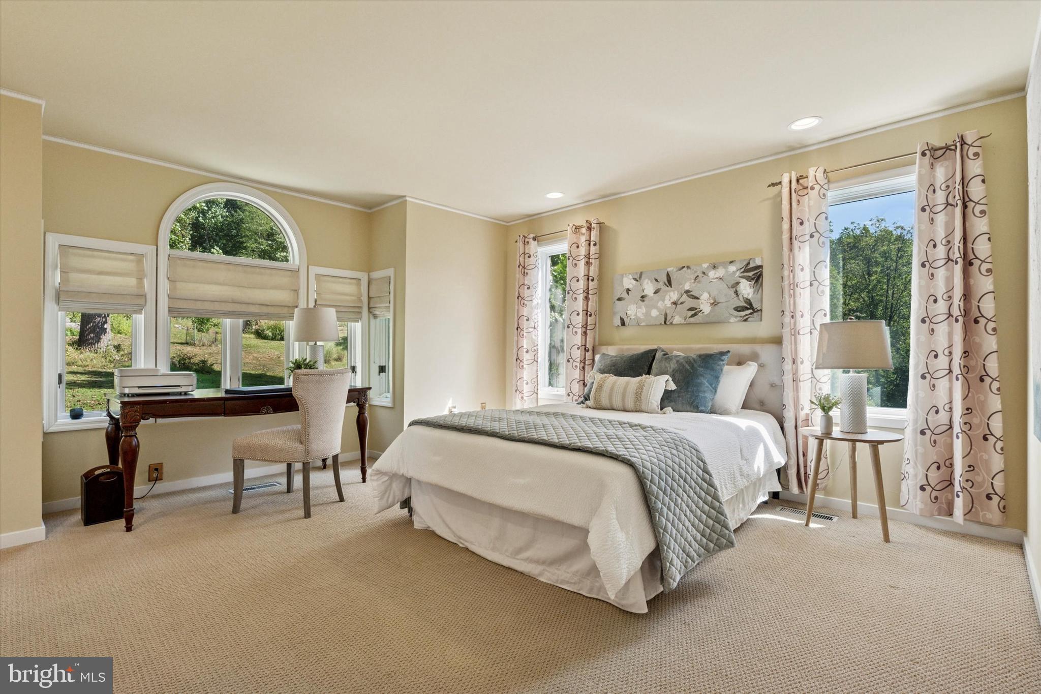 241 Painter Road Media, PA 19063 - Photo 27 of 44 a spacious bedroom with a bed and a large window