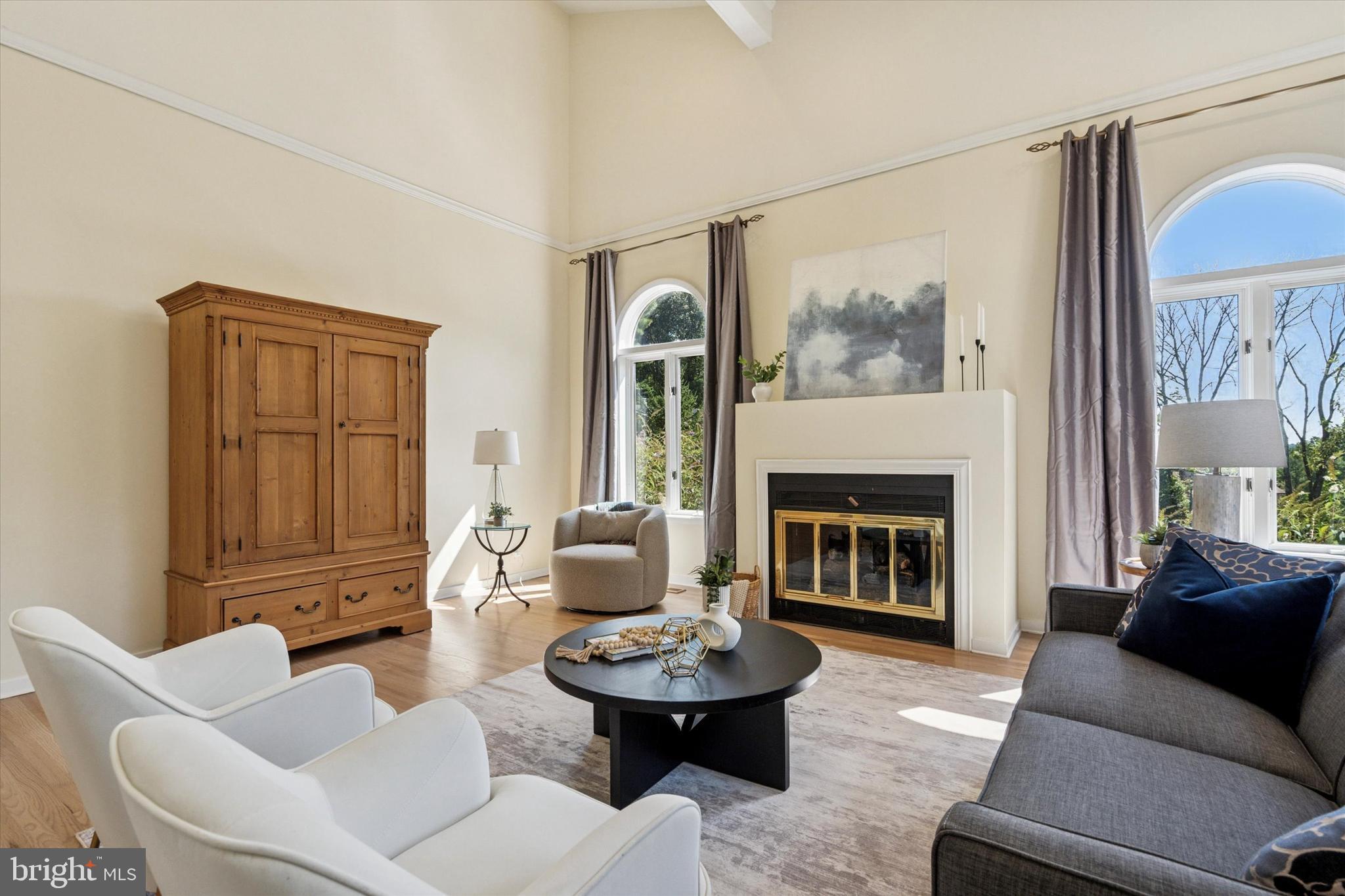 241 Painter Road Media, PA 19063 - Photo 5 of 44 a living room with furniture a fireplace and a large window