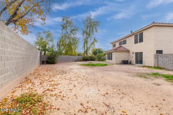 a view of a house with a yard and garage