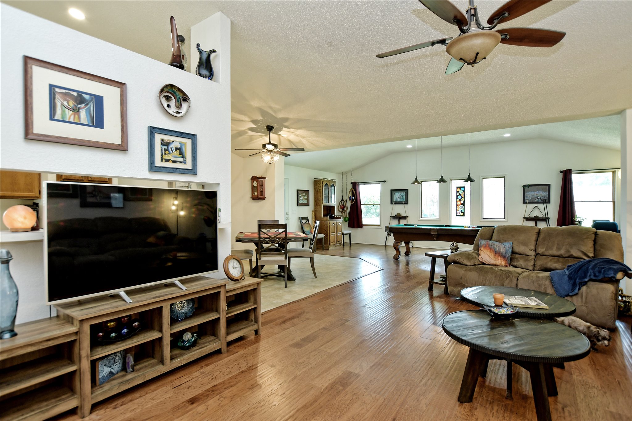 1002 West Noton Street Pflugerville, TX 78660 - Photo 3 of 32 The family room is open to the gameroom and dining areas.
