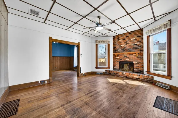 a view of an empty room with windows