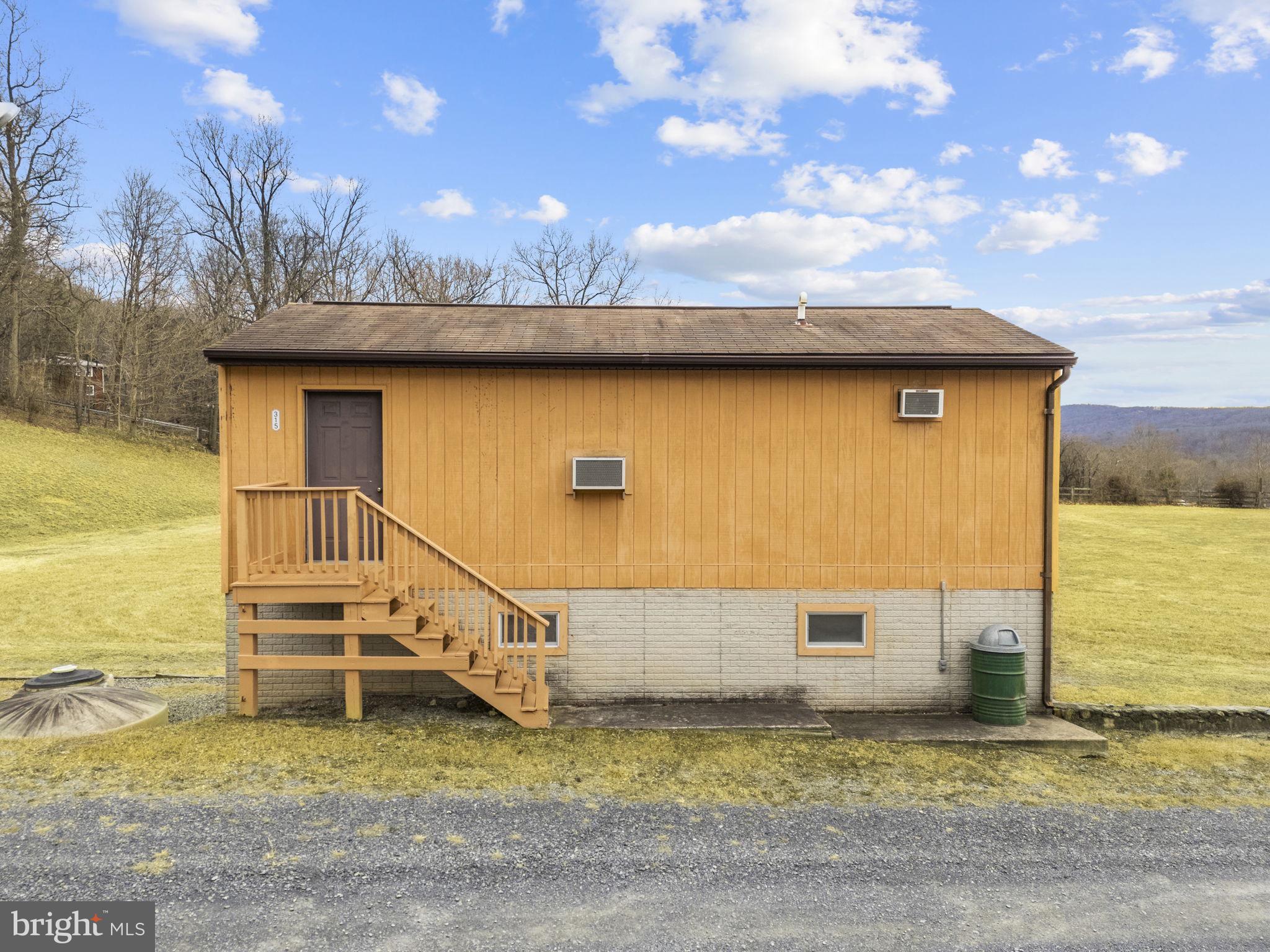303 Barbeque Drive Berkeley Springs, WV 25411 - Photo 33 of 68 a view of a terrace with a barbeque