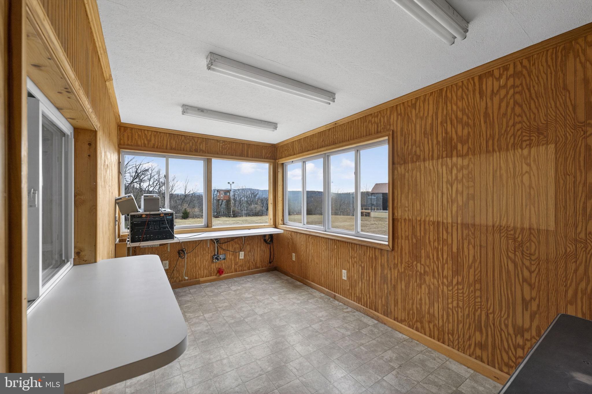 303 Barbeque Drive Berkeley Springs, WV 25411 - Photo 38 of 68 a large white room with a large window