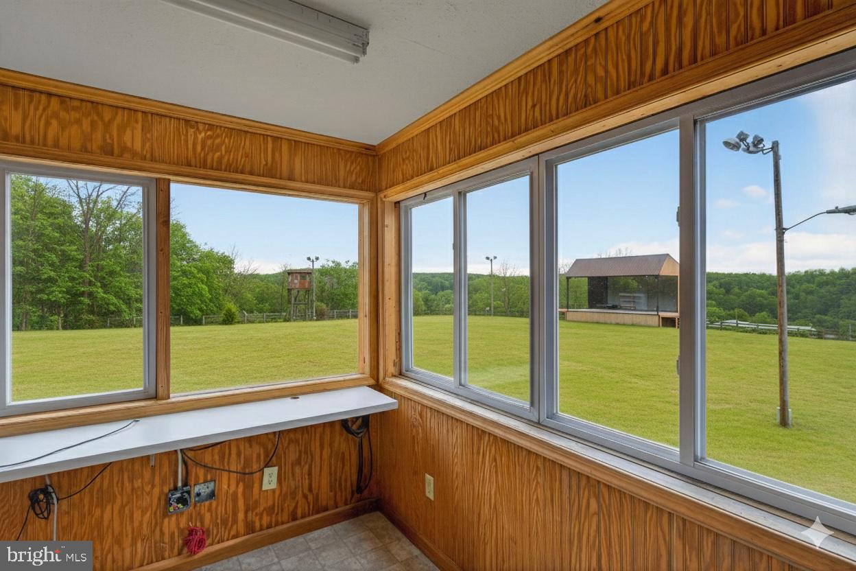 303 Barbeque Drive Berkeley Springs, WV 25411 - Photo 42 of 68 a view of a two room with a large window