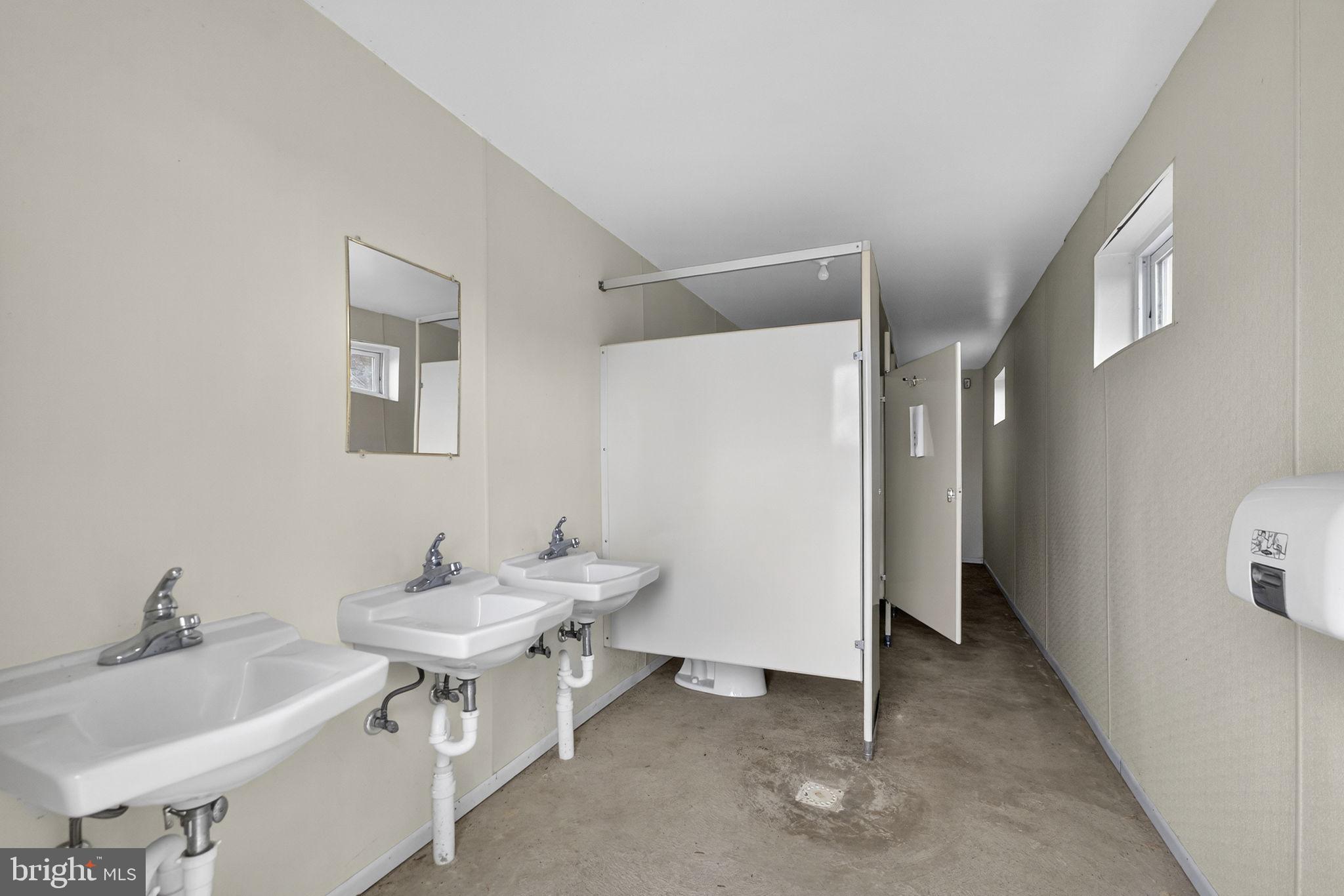 303 Barbeque Drive Berkeley Springs, WV 25411 - Photo 45 of 68 a bathroom with a sink and a mirror