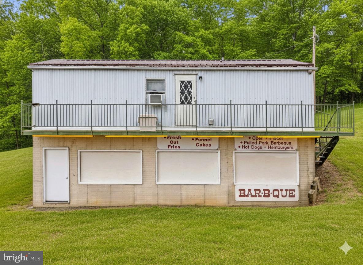 303 Barbeque Drive Berkeley Springs, WV 25411 - Photo 51 of 68 a view of a house with pool and a yard