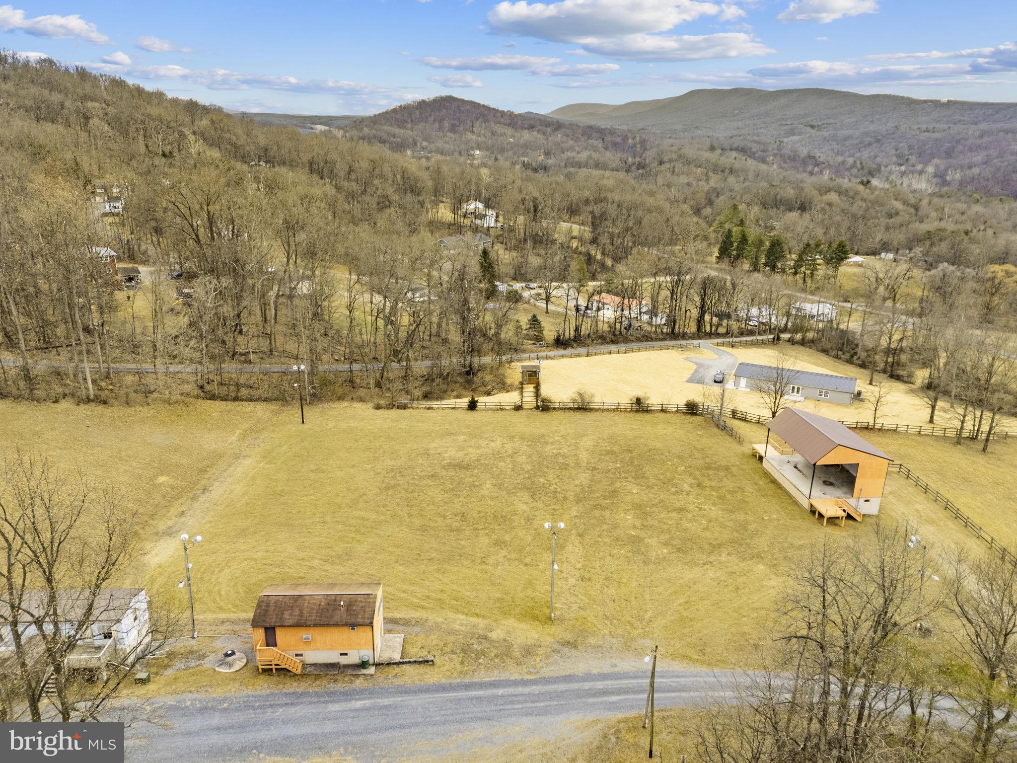 303 Barbeque Drive Berkeley Springs, WV 25411 - Photo 10 of 68 a view of a lake with mountains in the background