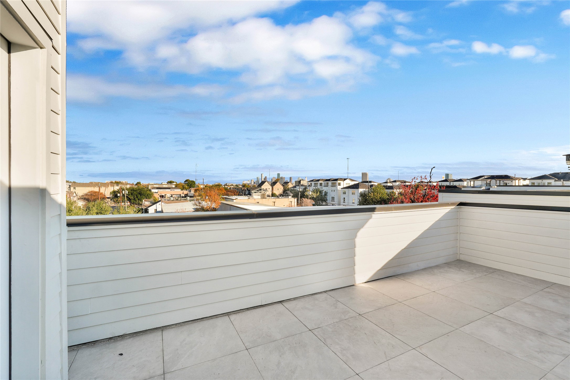 5439 Darling Street Houston, TX 77007 - Photo 32 of 42 Rooftop terrace with downtown views. Enjoy gatherings in this beautiful outdoor space, complete with gas and power connections for a grill or outdoor kitchen.