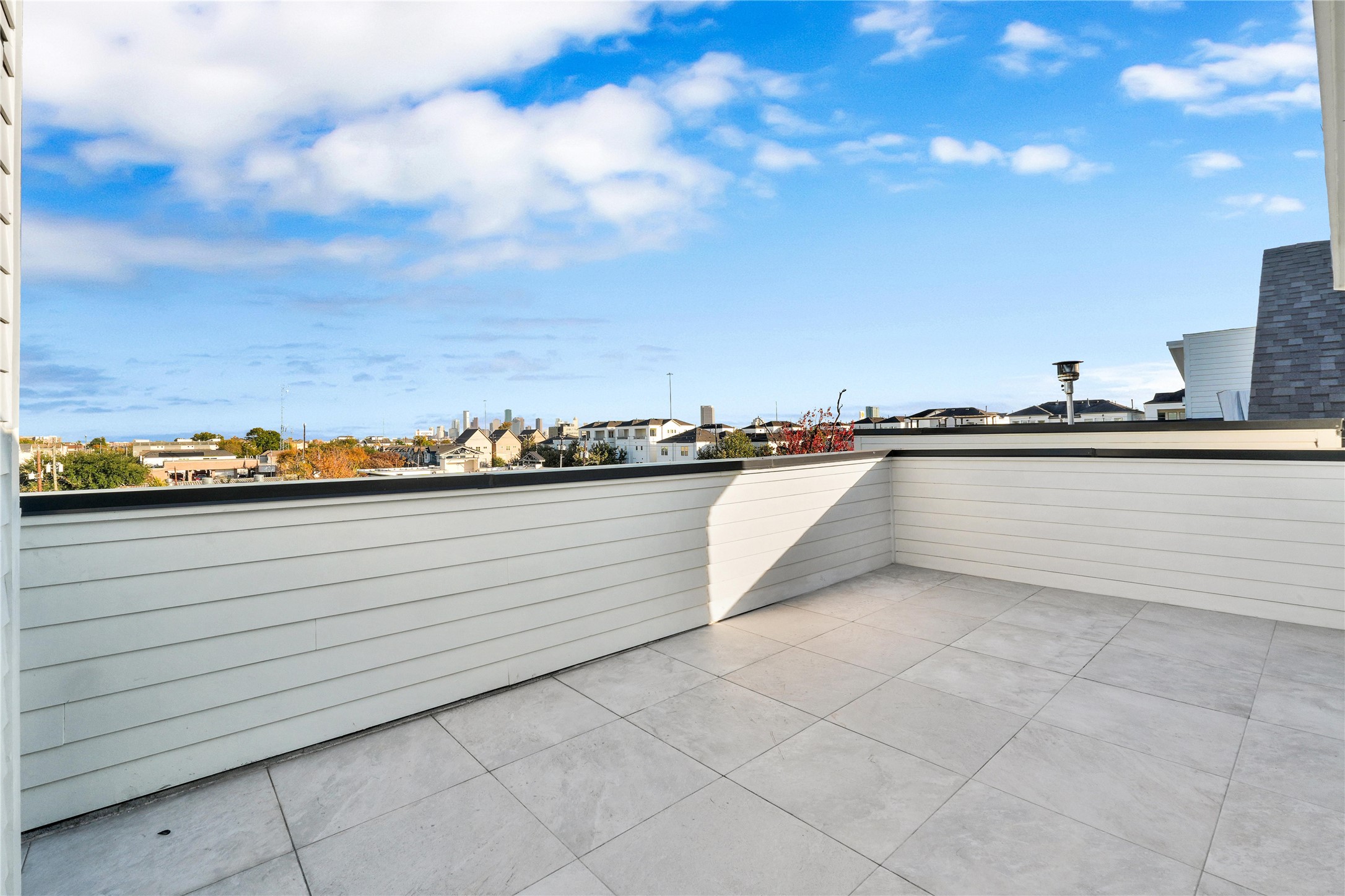 5439 Darling Street Houston, TX 77007 - Photo 34 of 42 Rooftop terrace with downtown views. Enjoy gatherings in this beautiful outdoor space, complete with gas and power connections for a grill or outdoor kitchen.