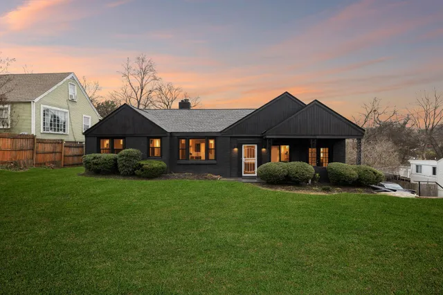 a front view of a house with a yard