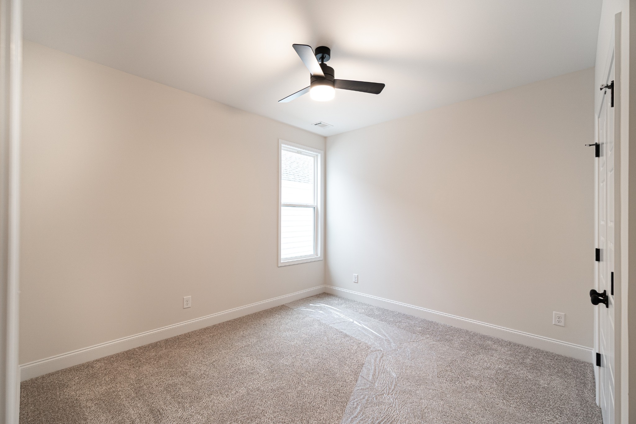 238 Franklin Street Pleasant View, TN 37146 - Photo 12 of 27 an empty room with windows and ceiling fan