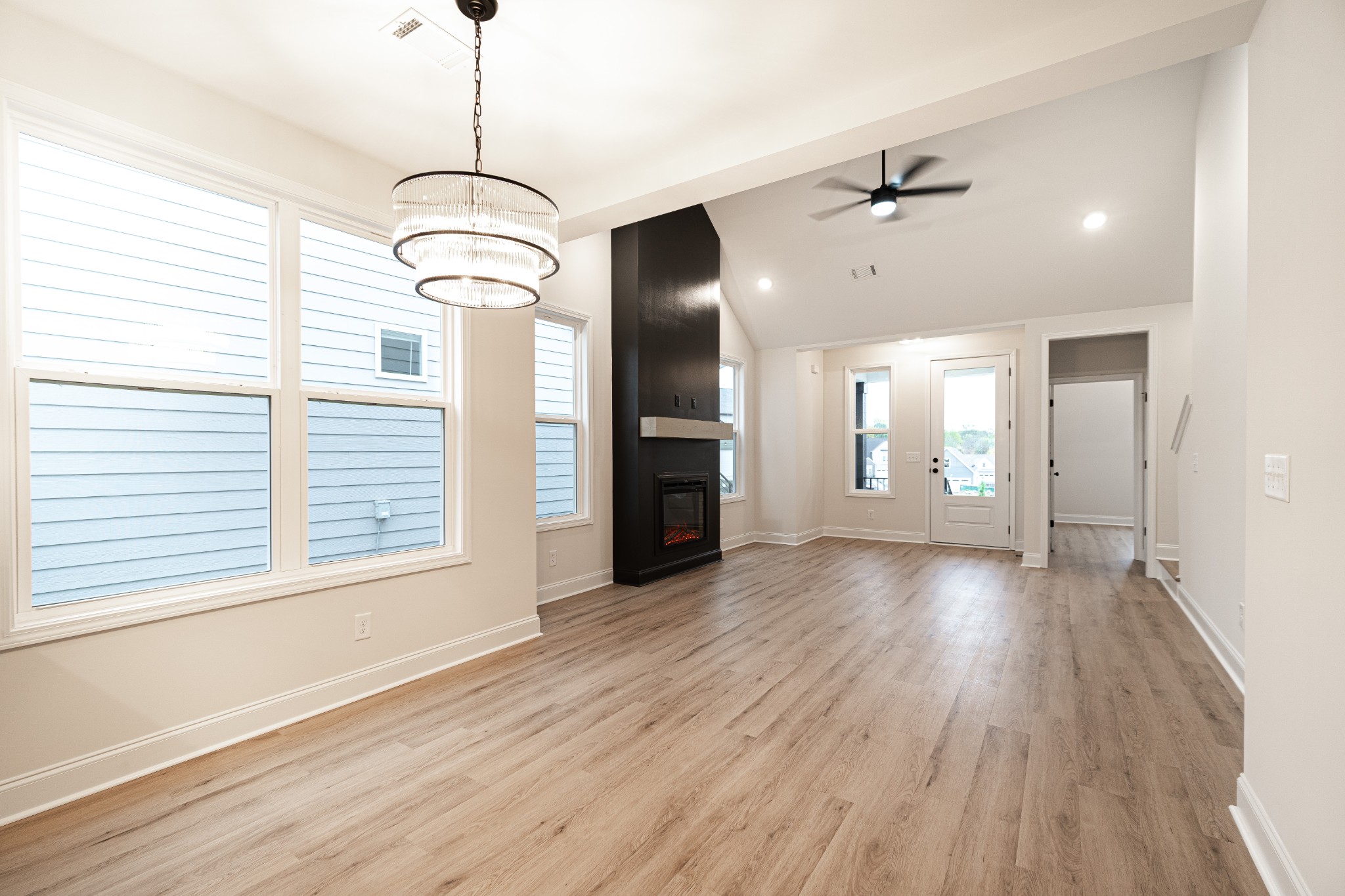 238 Franklin Street Pleasant View, TN 37146 - Photo 5 of 27 a view of a big room with wooden floor and windows