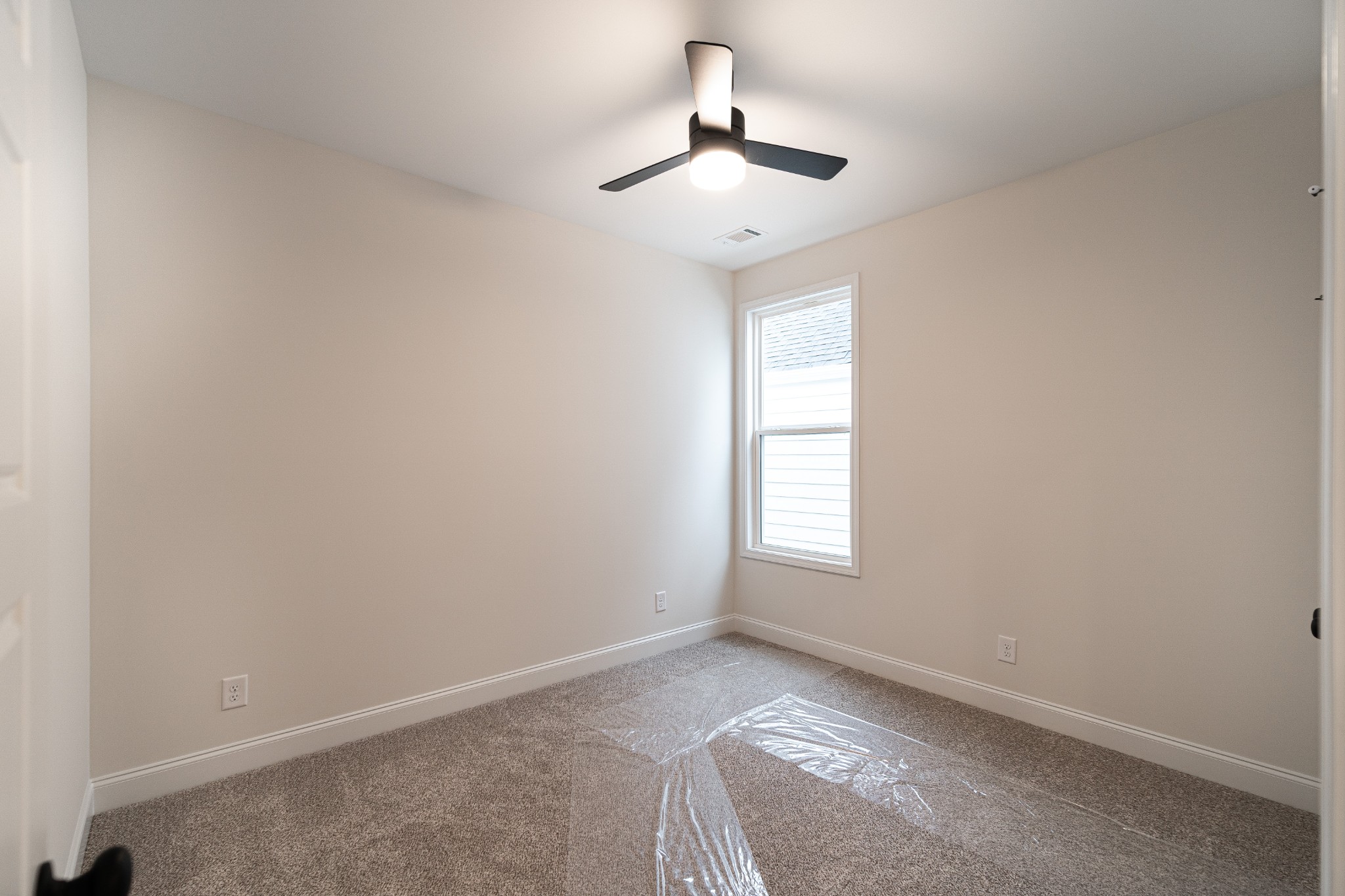 238 Franklin Street Pleasant View, TN 37146 - Photo 10 of 27 an empty room with windows and chandelier fan