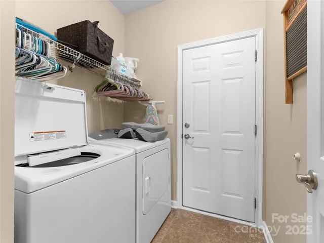 a kitchen with a refrigerator and cabinets