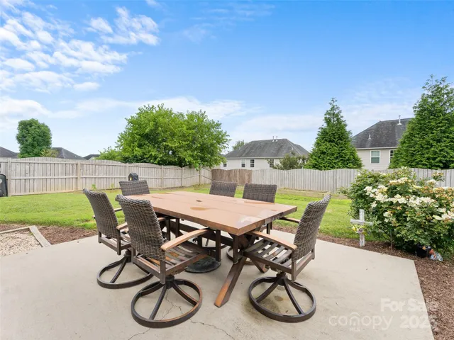 a patio with table and chairs