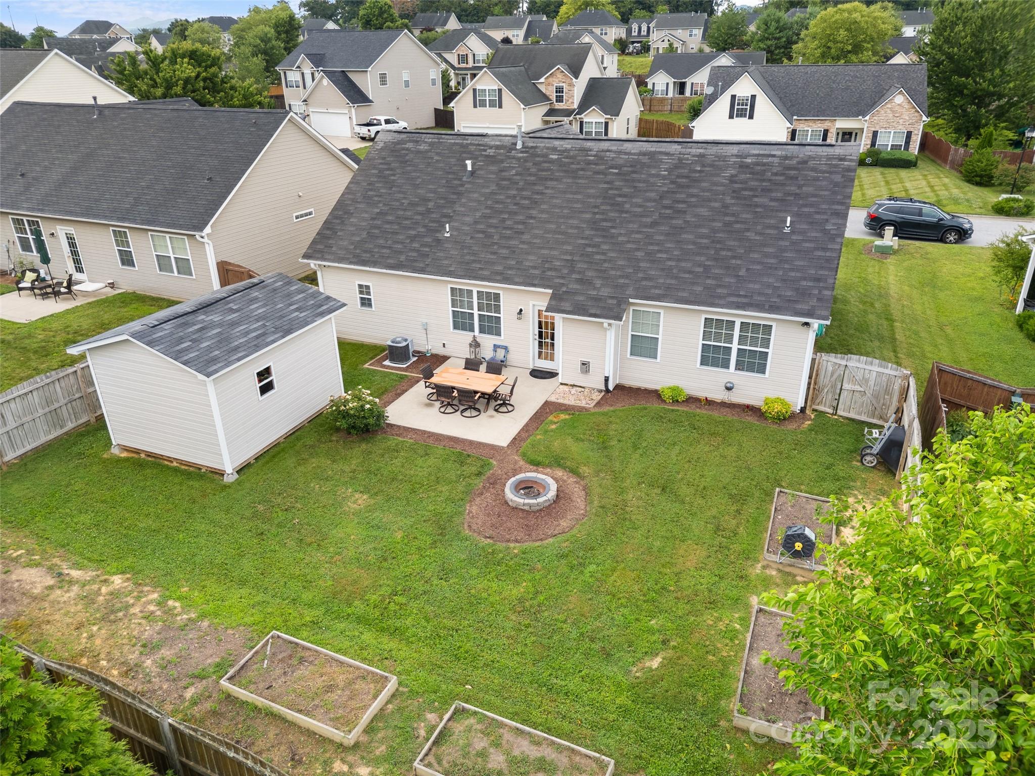 144 Haw River Road Fletcher, NC 28732 - Photo 23 of 31 an aerial view of a house with backyard outdoor space and swimming pool