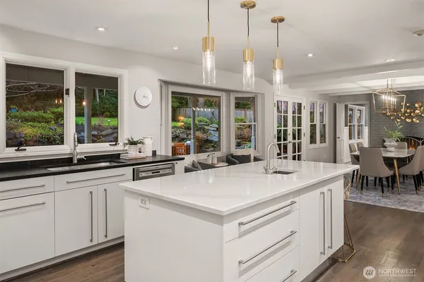 a view of center island with kitchen island and living room