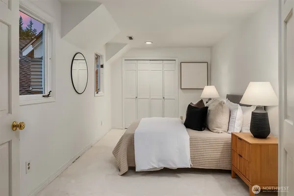 a bedroom with a bed and a table
