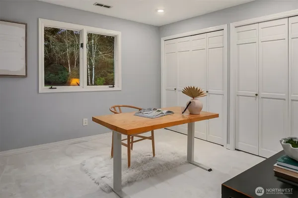a view of a workspace with furniture