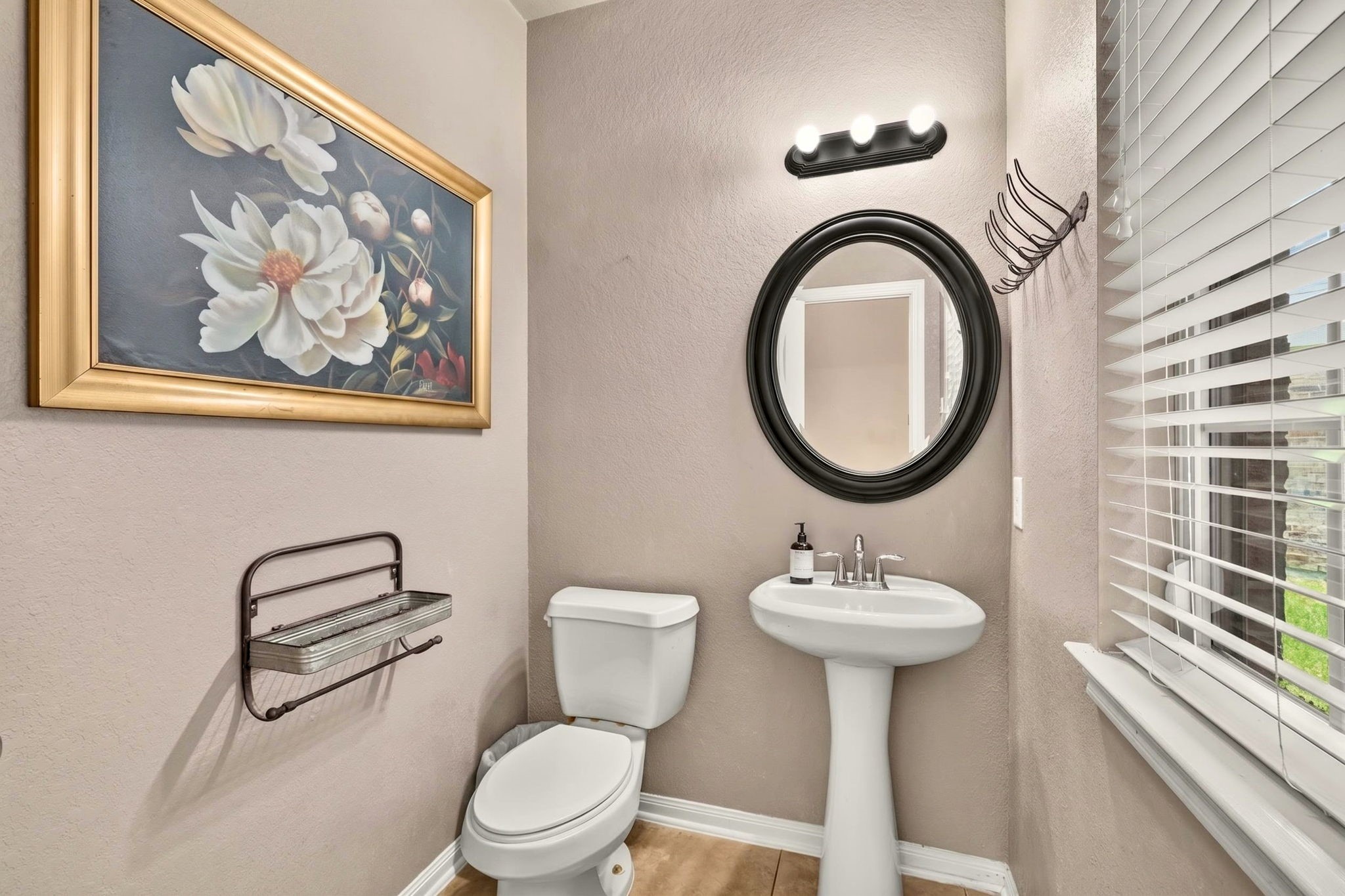 6446 Tea Tree Drive Katy, TX 77494 - Photo 10 of 39 Half bathroom is right by the entry way.