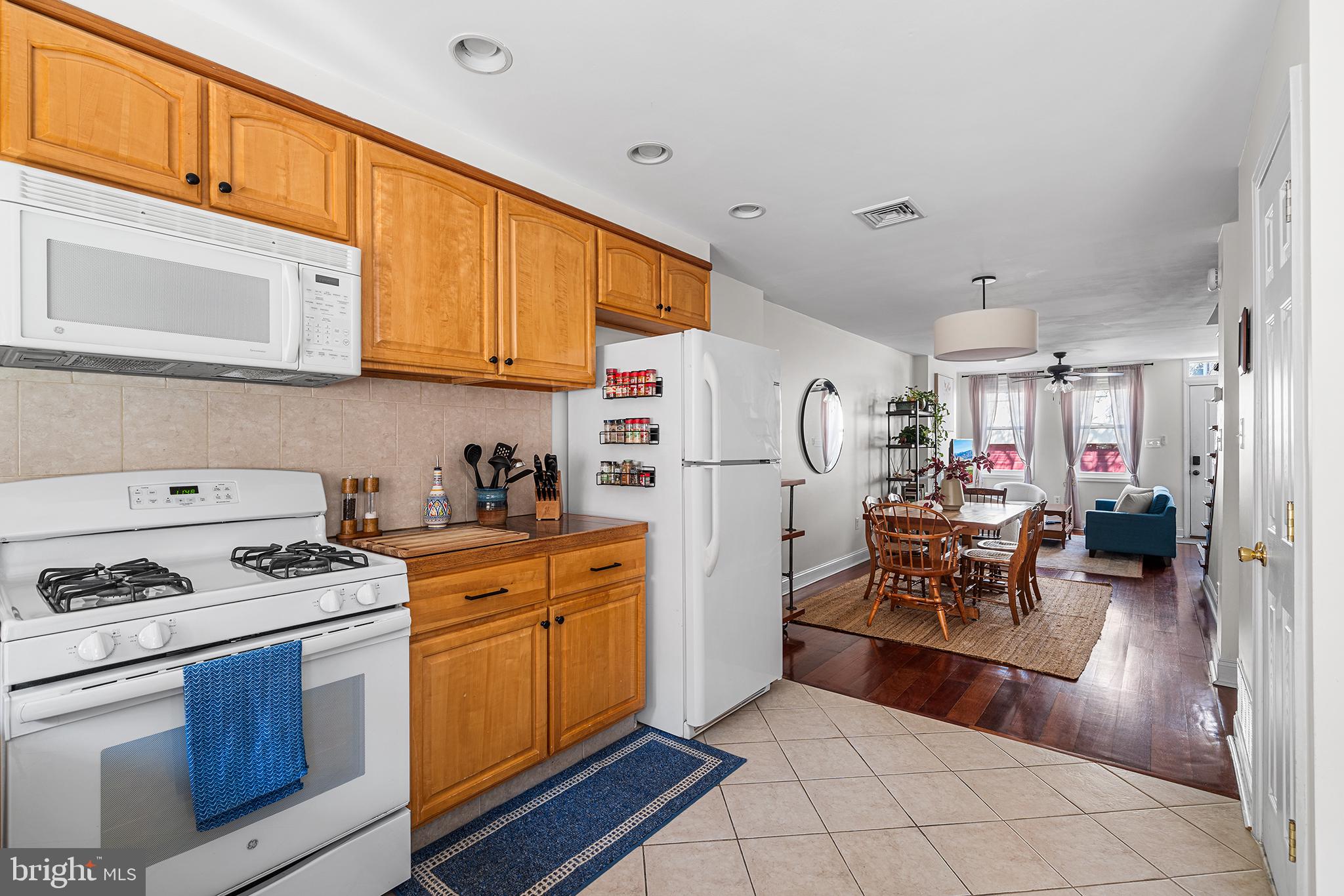 2520 Webster Street Philadelphia, PA 19146 - Photo 12 of 24 a kitchen with stainless steel appliances a stove a sink and cabinets