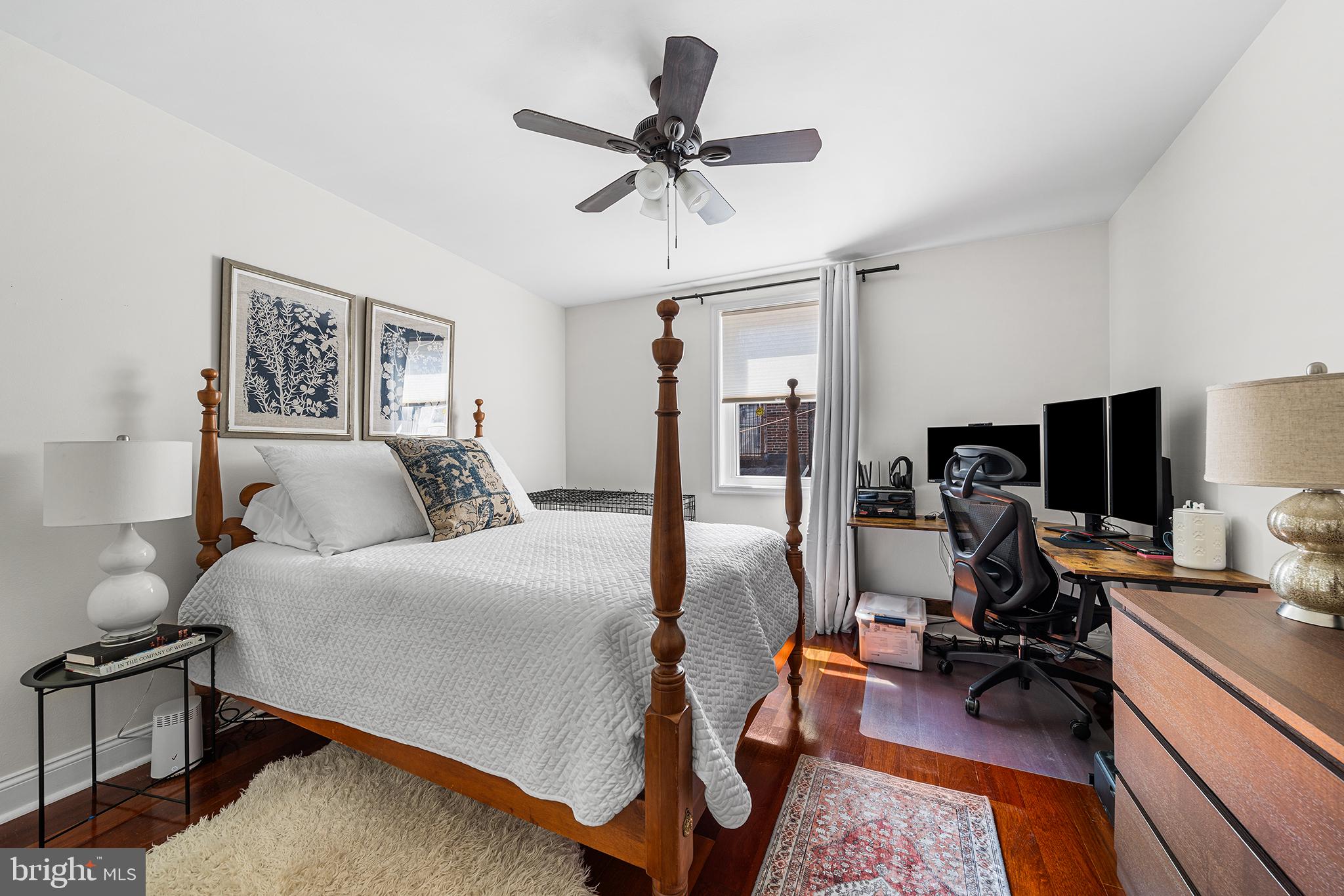 2520 Webster Street Philadelphia, PA 19146 - Photo 14 of 24 a bed room with a bed furniture and a flat screen tv