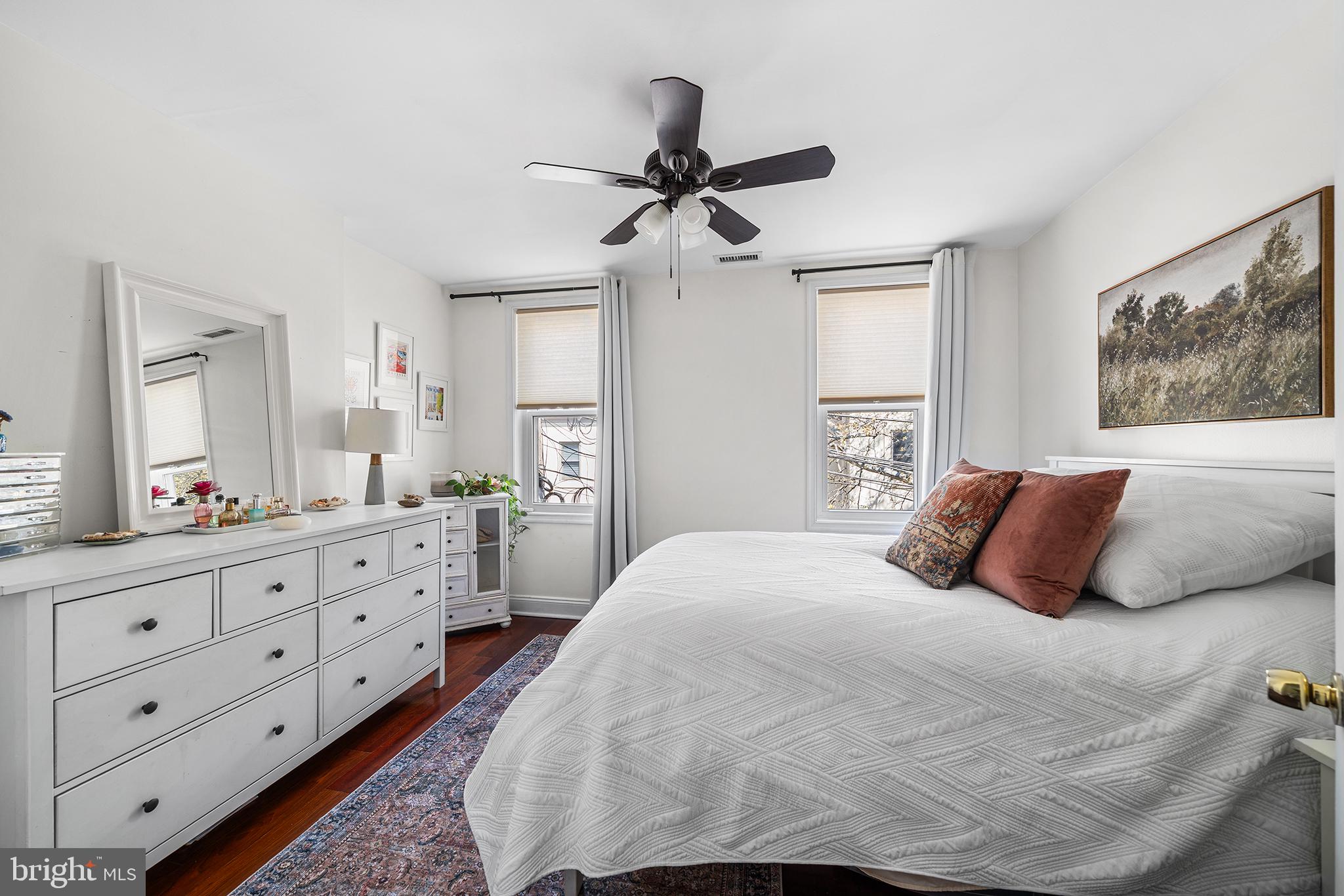 2520 Webster Street Philadelphia, PA 19146 - Photo 19 of 24 a bedroom with a large bed and a chandelier