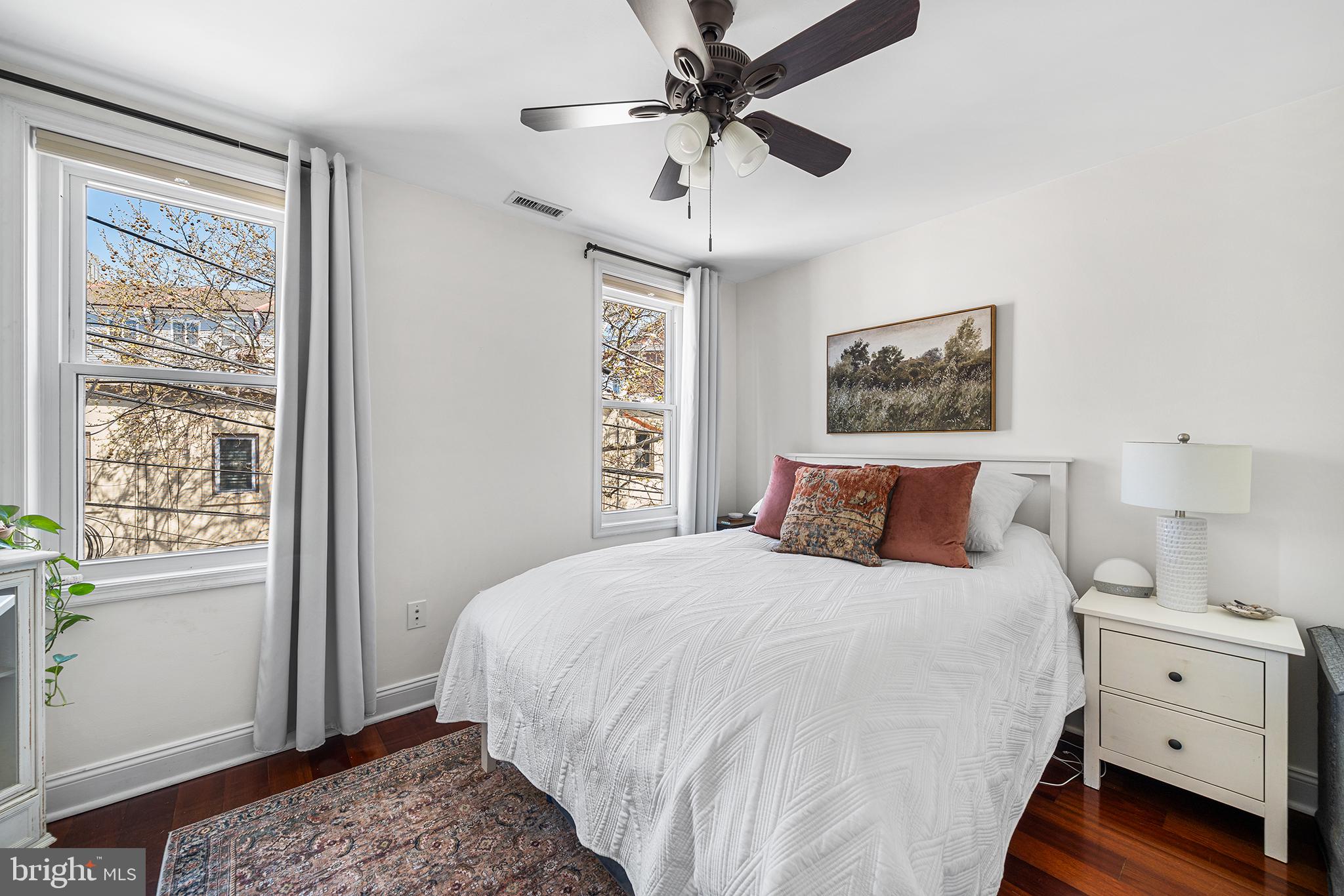 2520 Webster Street Philadelphia, PA 19146 - Photo 20 of 24 a bedroom with a large bed and a window