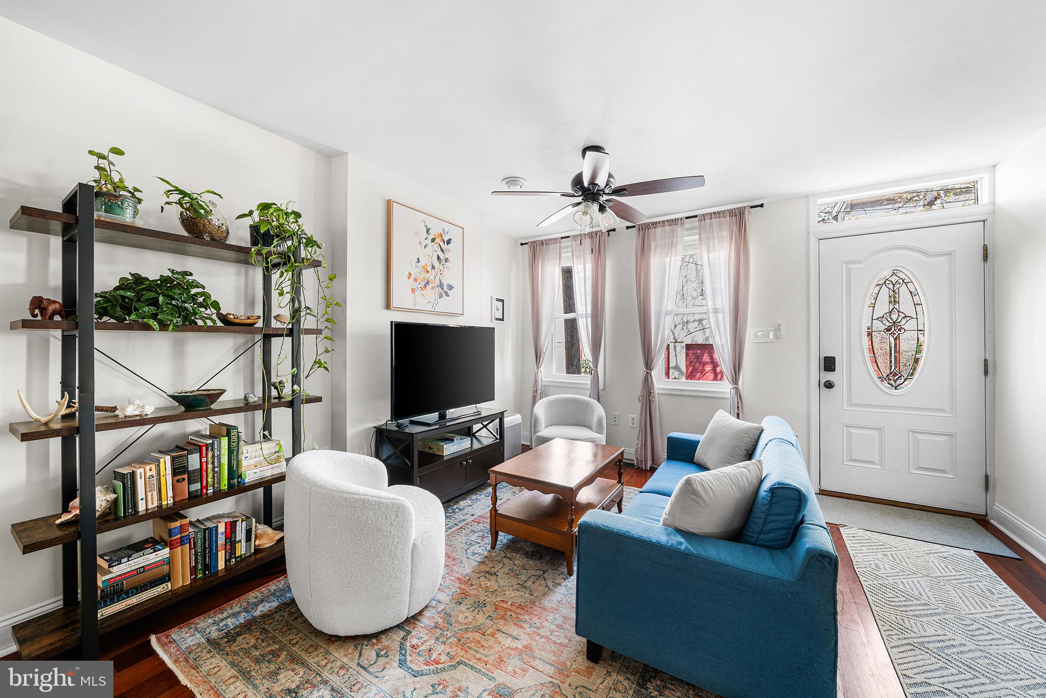 2520 Webster Street Philadelphia, PA 19146 - Photo 5 of 24 a living room with furniture a rug and a flat screen tv