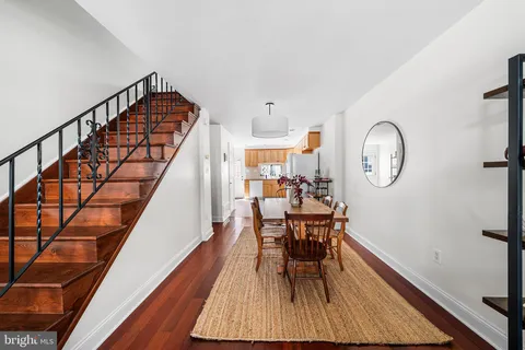 a view of dining room and wooden floor