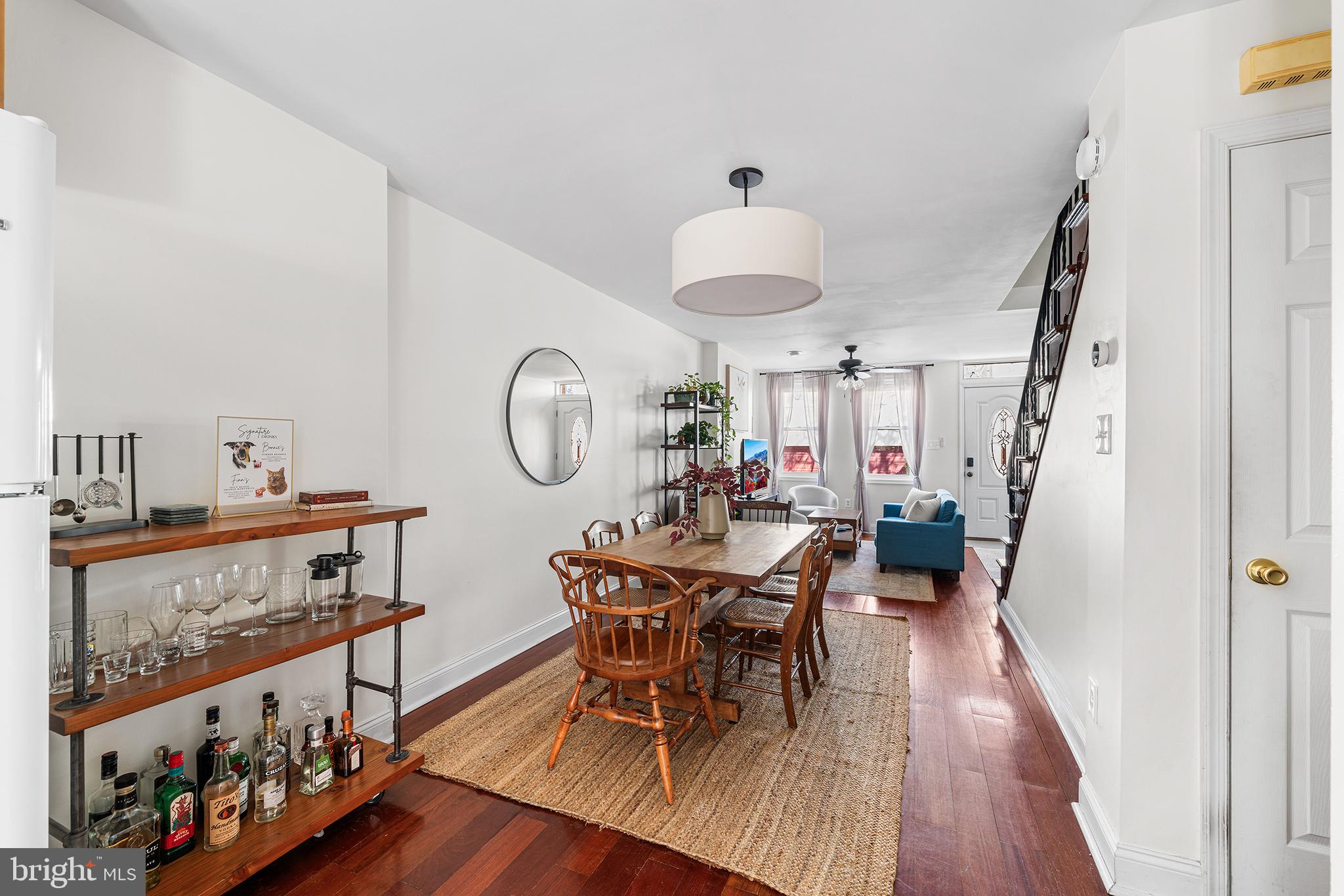 2520 Webster Street Philadelphia, PA 19146 - Photo 8 of 24 a view of a dining room with furniture a chandelier and wooden floor